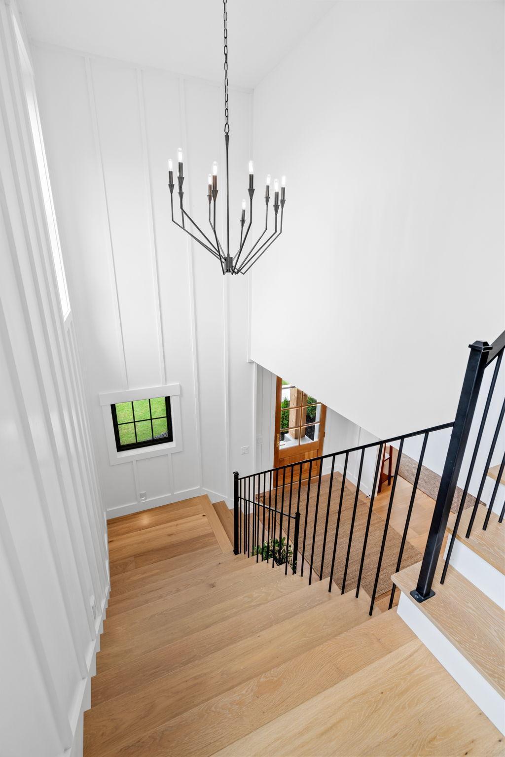 The elegance of this home is accentuated by the stunning white oak floors that seamlessly flow through the main living areas and lead to the upper level.