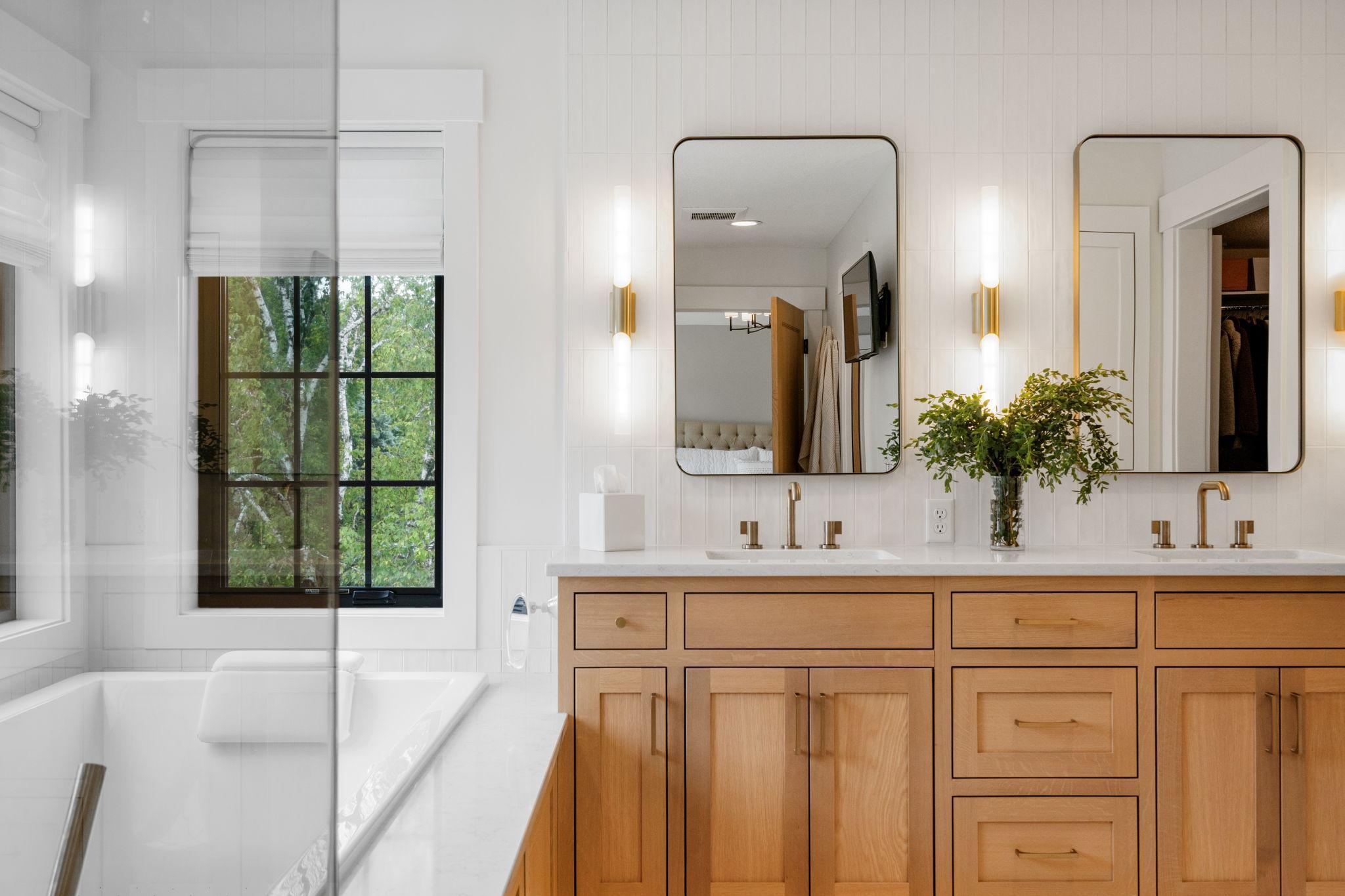 You are greeted by the soft glow of high end lighting as well as natural light from the windows that illuminates the room, evoking a sense of timeless elegance.