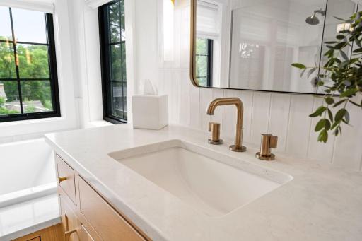 Quartz counter tops enhance the style of the all the bathrooms through out the upper level of the home.