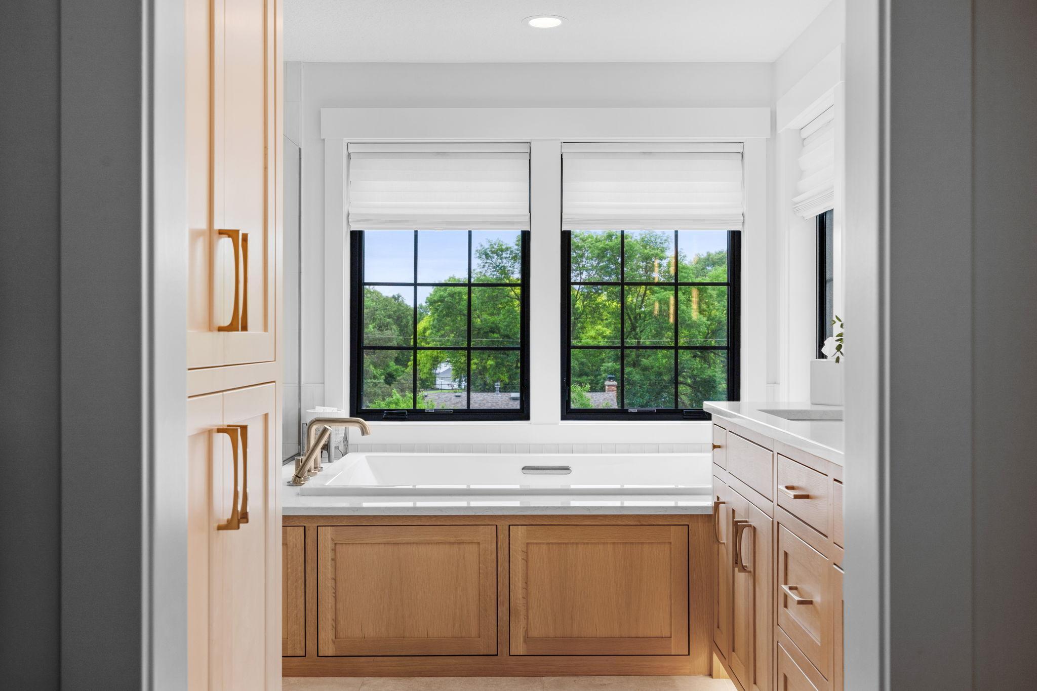 Primary bathroom includes a luxurious bubble tub perfect for relaxation