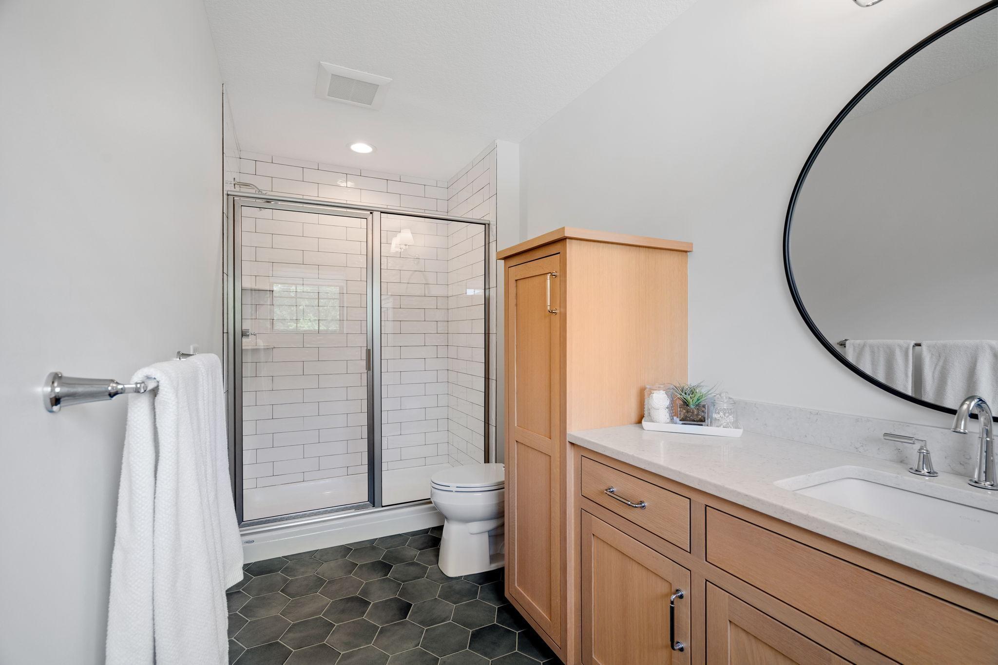 The focal point of this haven is the elegant ensuite 3/4 tile shower, a luxurious retreat in its own right. Adorned with timeless tile work offering a space where guests can refresh and unwind.