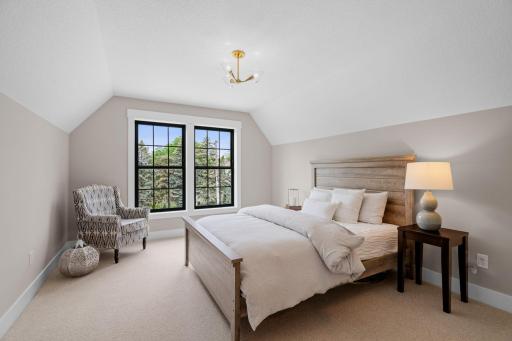 Step into a realm of sophisticated living with this exquisite arrangement of two upper bedrooms, seamlessly connected by a luxurious Jack and Jill bathroom.