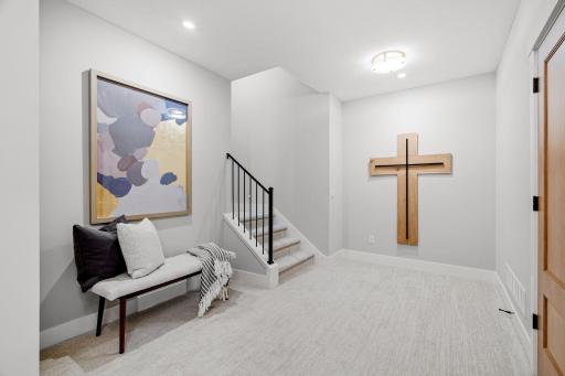 The lower level of this home is a well-appointed space designed for entertaining, featuring a range of high-end finishes and thoughtful details.
