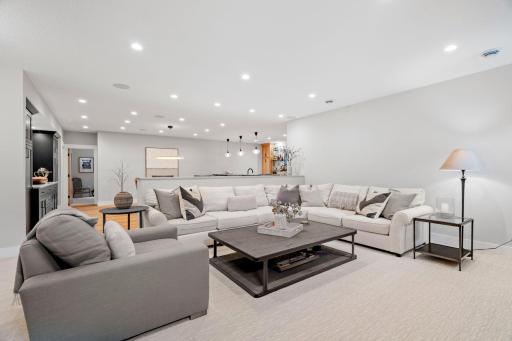 Recessed lighting and built-in speakers throughout the space ensure an inviting atmosphere with excellent sound quality.