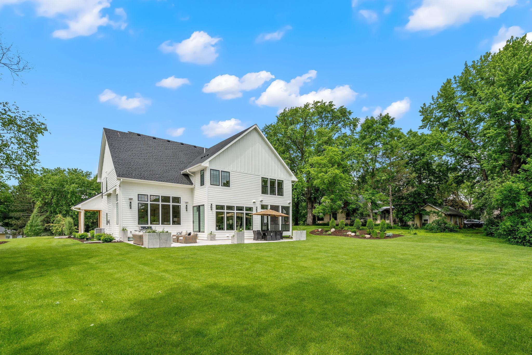 The flat backyard is a versatile outdoor space, ideal for various activities and gatherings.