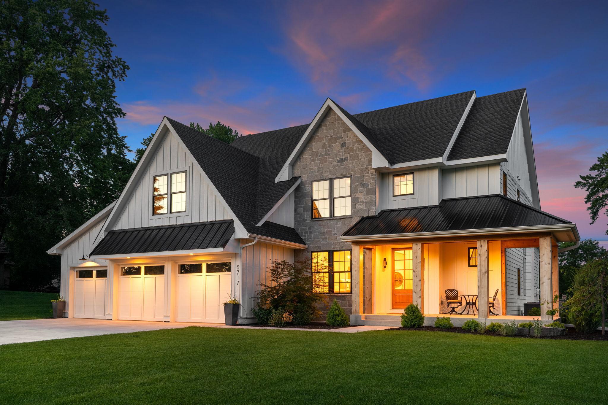 As twilight descends upon the horizon, casting its ethereal glow across the landscape, the exterior of this home transforms into a scene of enchantment and allure.