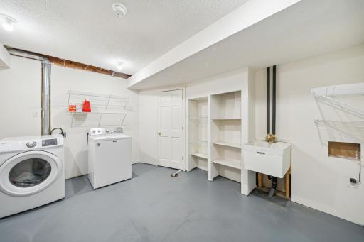 Spacious laundry room. Lots of storage space in here.