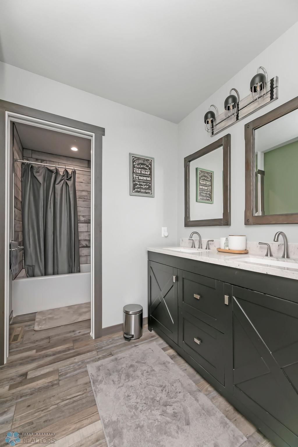 Full Bathroom on Main Level w/ Double Sinks & plenty of storage