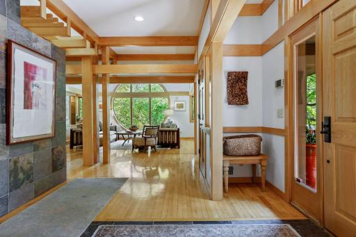 The grand entry foyer is instantly welcoming & connects to the main living area.
