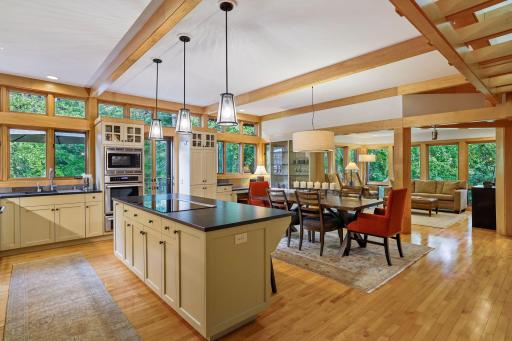 Recently renovated center island kitchen with leathered granite countertops & stainless steel appliances.