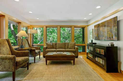 Sunroom off kitchen with south-facing views of woods & wildlife.