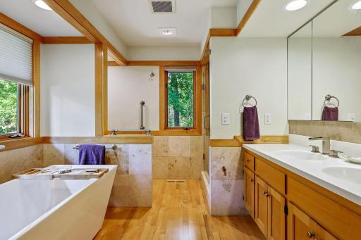 Separate tub & shower areas in the adjacent full bath with double sinks.