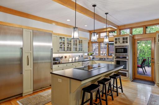 Kitchen offers one of four doors to the generous deck.