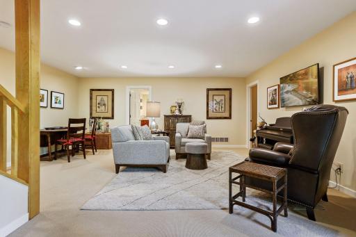 Lower level family room offers gathering space for the four lower level bedrooms plus door to the patio.