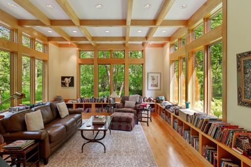 Great room with panoramic views offers numerous possibilities. Acoustically designed as a music room by Michaela Mahady. This space doubles as a writer's paradise with an abundance of bookshelves. Imagine your own uses!