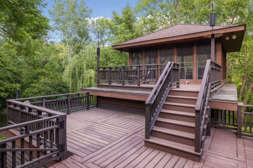 Screen porch of the main deck complete with pull down movie screen