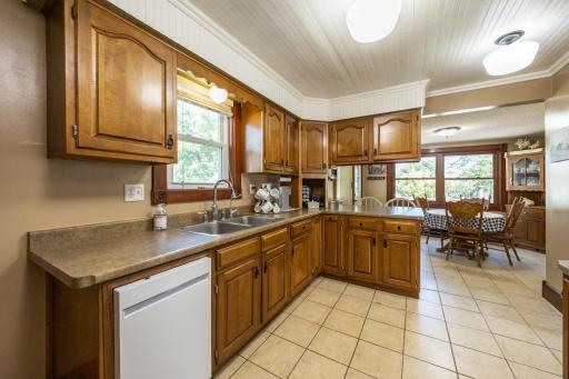 Freshly painted kitchen with tons of natural light over looking back yard