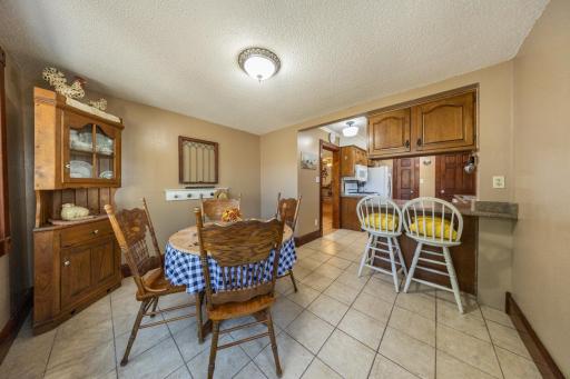 Eat in kitchen! Over looks the back yard and the deck. Deck door enters into the kitchen with dining table and countertop eating for 2.