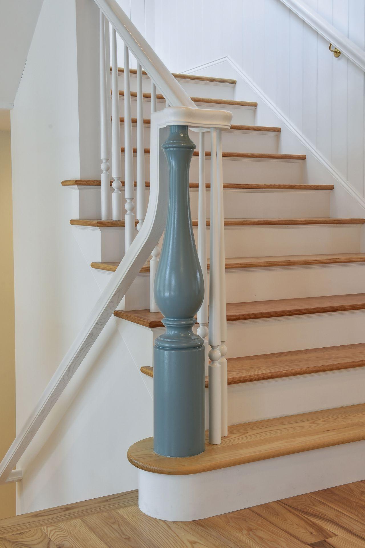 Large stair cases with custom newels and paint colors