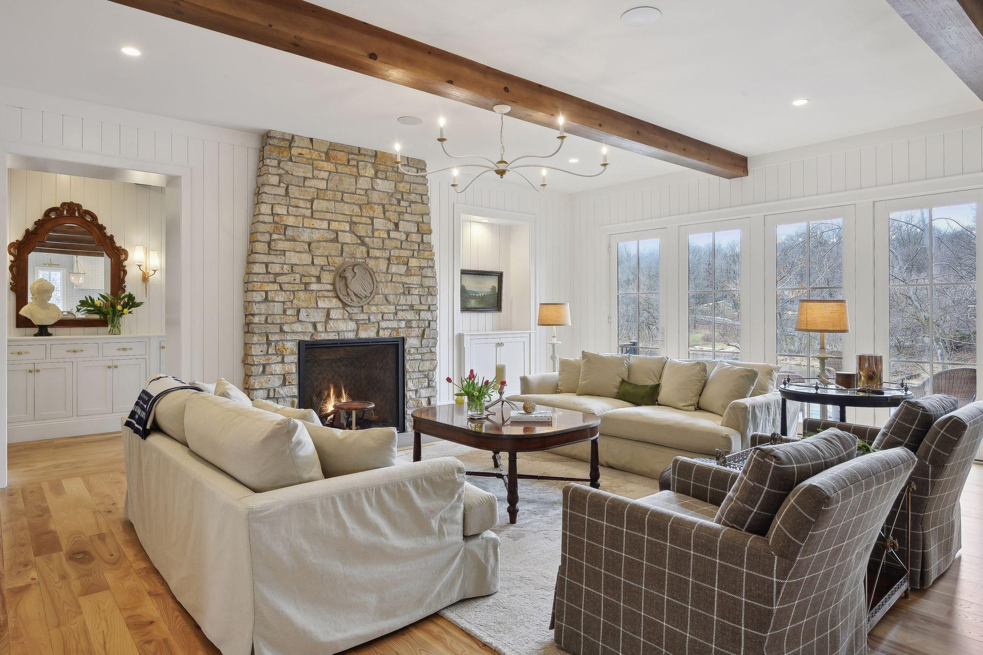 Cozy living area with south views of lake, doors open to large deck