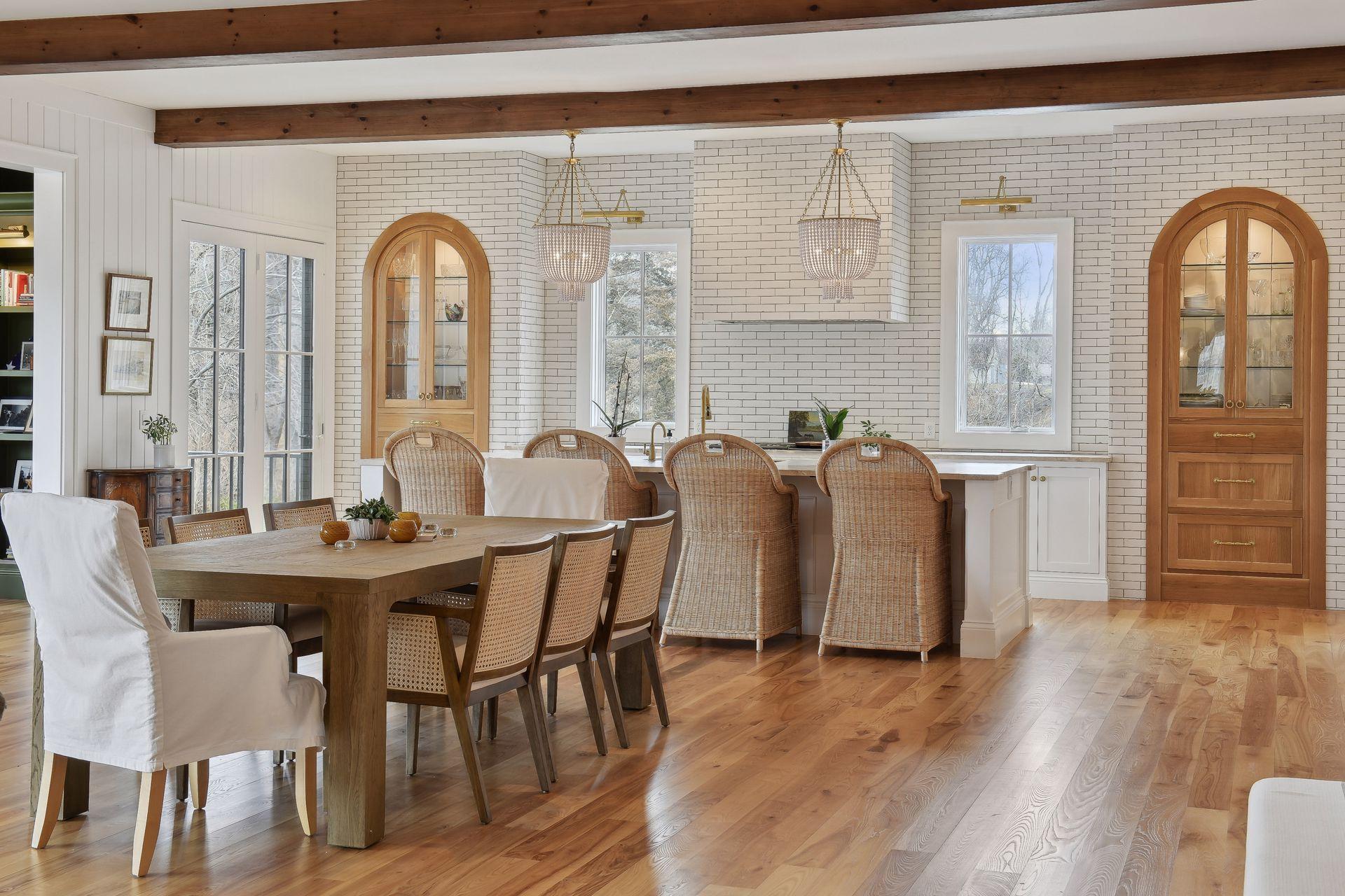 adjacent kitchen and dining spaces with hardwood throughout