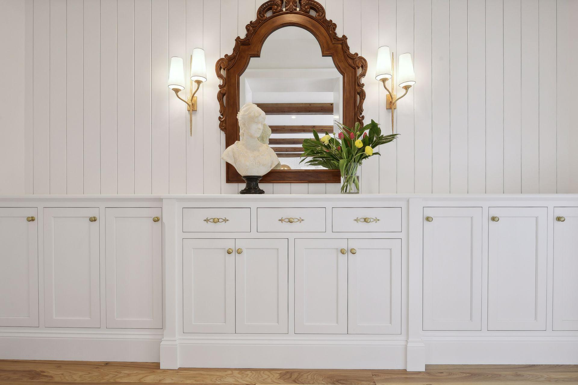 hall to primary bedroom with built in cabinets