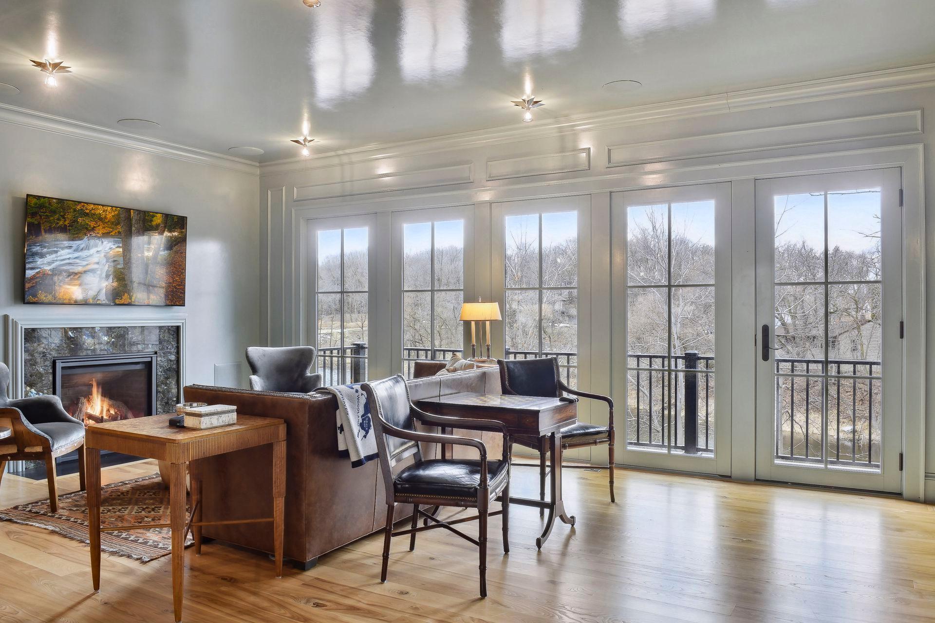 large windows overlooking lake with deck