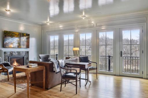large windows overlooking lake with deck