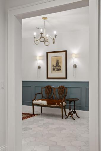 marble floors, paneled walls