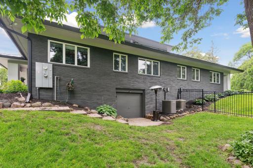 Garage Door access to lower level storage room - lawn, garden, paddle boards and more