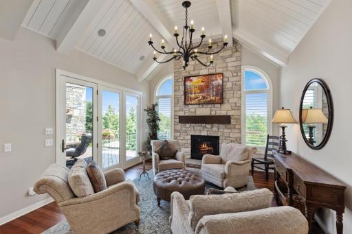 Cozy Sunroom off of Kitchen with spectacular fireplace and access to deck