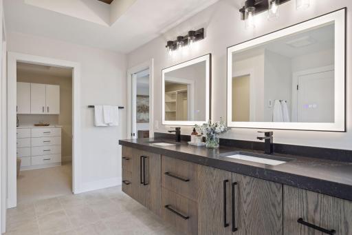 Owner's suite bathroom double sinks & lighted mirrors