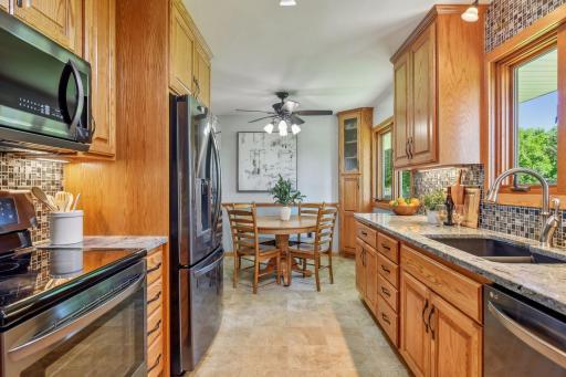 The kitchen offers a bright and airy space to enjoy meals.