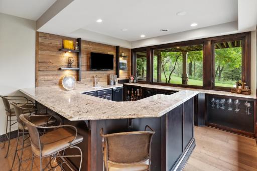 Spectacular Bar with Sink, Dishwasher, and fridge.