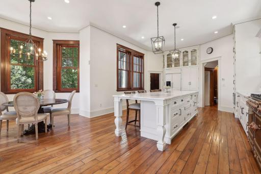 The eat-in kitchen overlooks the private, fully enclosed backyard.