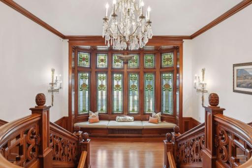 Stunning carved mahogany millwork and original stained-glass windows.