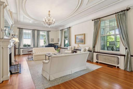 This living room has plenty of space for a grand piano. Check out the totally restored plaster ceilings.