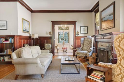 Family room has wood burning fireplace. It is perfectly located between the sunroom, grand foyer and living room.