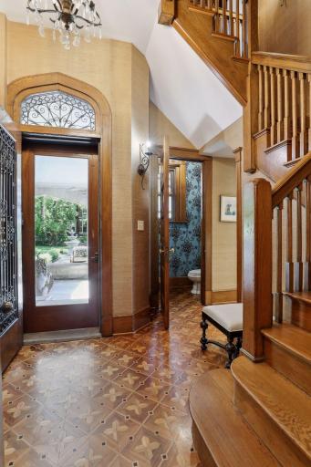 Original servants entrance is next to the kitchen and 2nd set of stairs. The 1/2 bath and hall have in-floor heat.