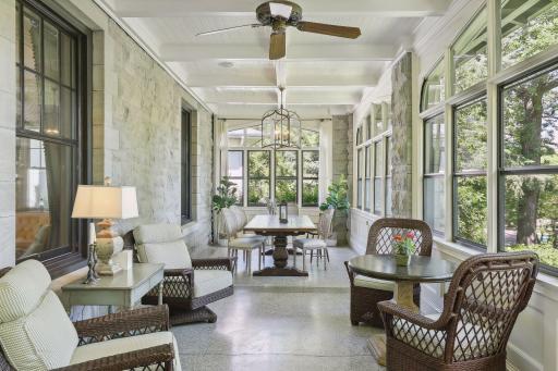 Three-season porch has original terazzo floors, all new windows and runs the length of the house. Note: 3-season porch is excluded from the finished square footage.