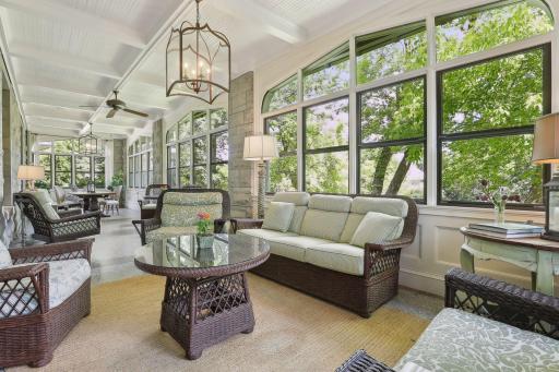 Three-season porch that runs the length of the house. It is fabulous space for entertaining friends and family. Note: 3-season porch is excluded from the finished square footage.