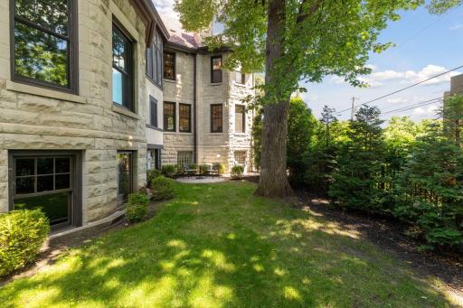 Kitchen overlooks fully enclosed backyard.