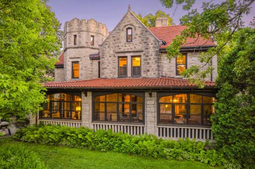 Fabulous oversized 3-season porch overlooks the private front yard.