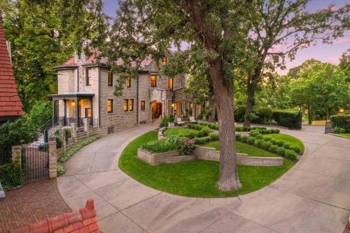 Sweeping circular drive provides plenty of space for guest off street parking.