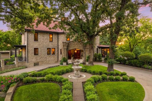 Beautiful landscaped garden with sweeping circular drive.