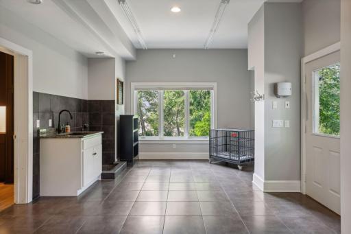 Mud Room leads to Pet Zone with Turf