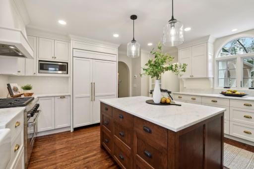The paneled Sub-Zero refrigerator/freezer seamlessly blends into the cabinetry