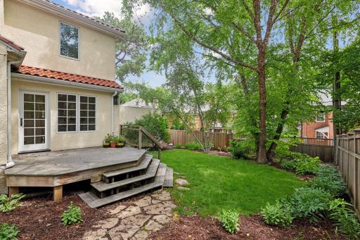 The back deck guides you to the lovely, private yard.