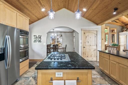 The kitchen flows effortlessly into the formal dining room.