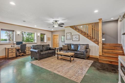 The lower level which has colored concrete in floor heating, custom full daylight
windows.